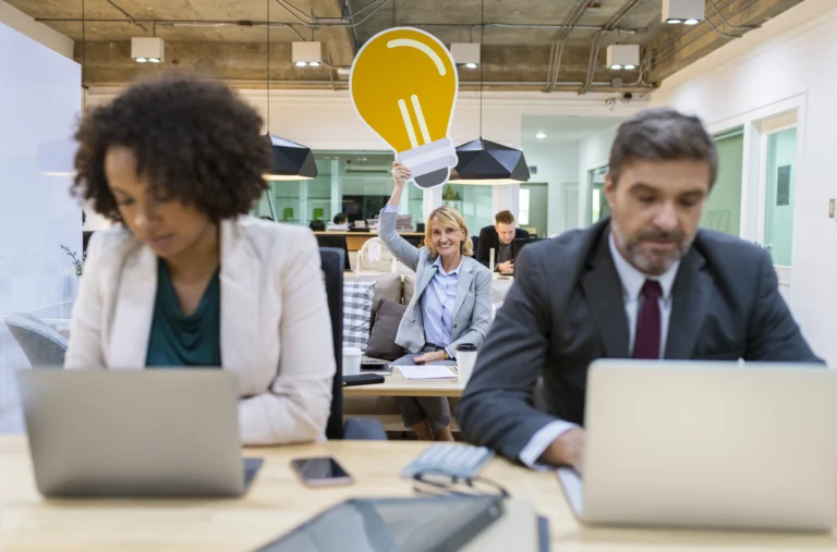 Two business professionals discussing legal strategies in an office, representing business law for Florida startups.